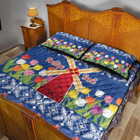 Blue quilt bed set with windmill and tulip flower print, white snowflake border; two pillows