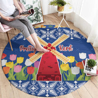Blue round Christmas rug with windmill and tulip flowers, snowflake border, “Prettige Kerst”