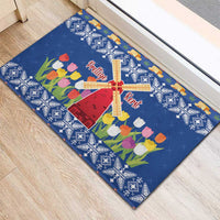 Blue Christmas rubber doormat with windmill, tulip flowers, and snowflake pattern