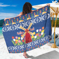 Blue Christmas sarong wrap with windmills, tulips, and village icons