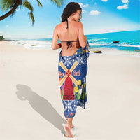 Blue Christmas sarong with windmills, tulips, and red-roof hut pattern, tied