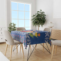 Blue tablecloth with folk motifs, windmill scene, and tulip flowers for dining table