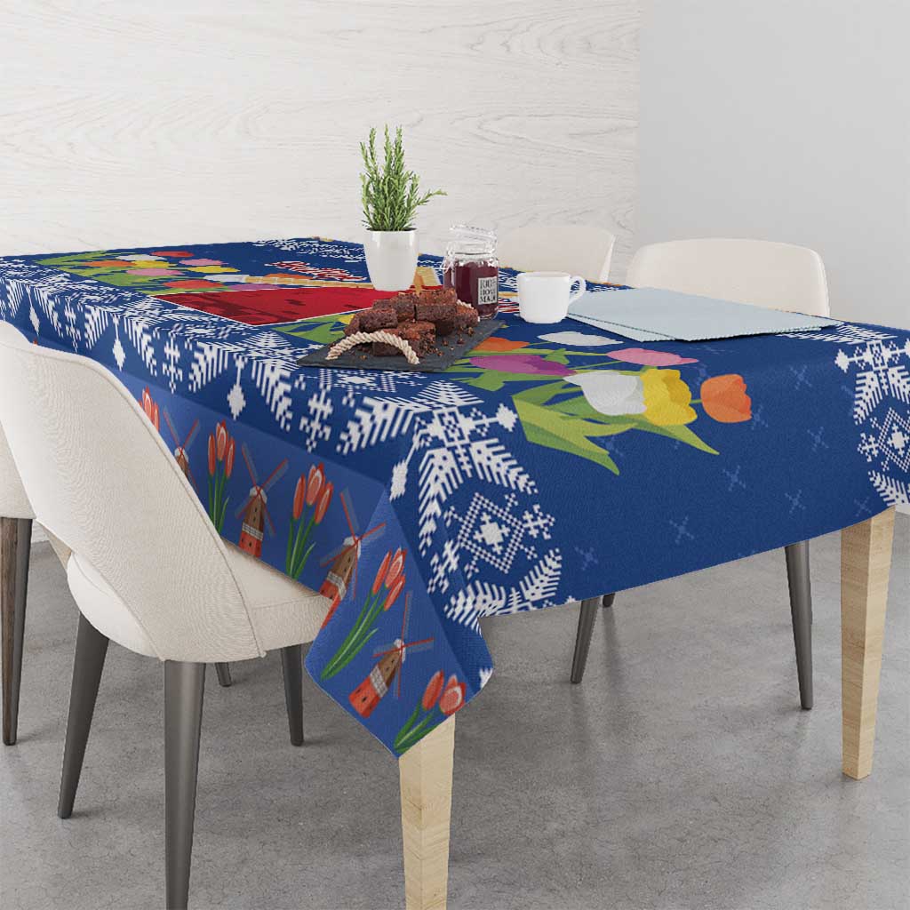 Blue printed tablecloth with tulips, windmill house, and patterned borders