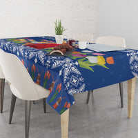 Blue printed tablecloth with tulips, windmill house, and patterned borders