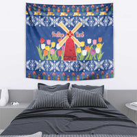 Blue Christmas tapestry showing windmill over colorful tulip garden with blue white pattern