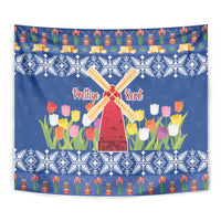 Blue Christmas tapestry with windmills, tulip flowers, and festive icons in border