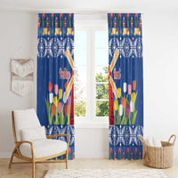 Blue Christmas window curtain pair with tulip flowers, windmills, and snowflake diamond pattern