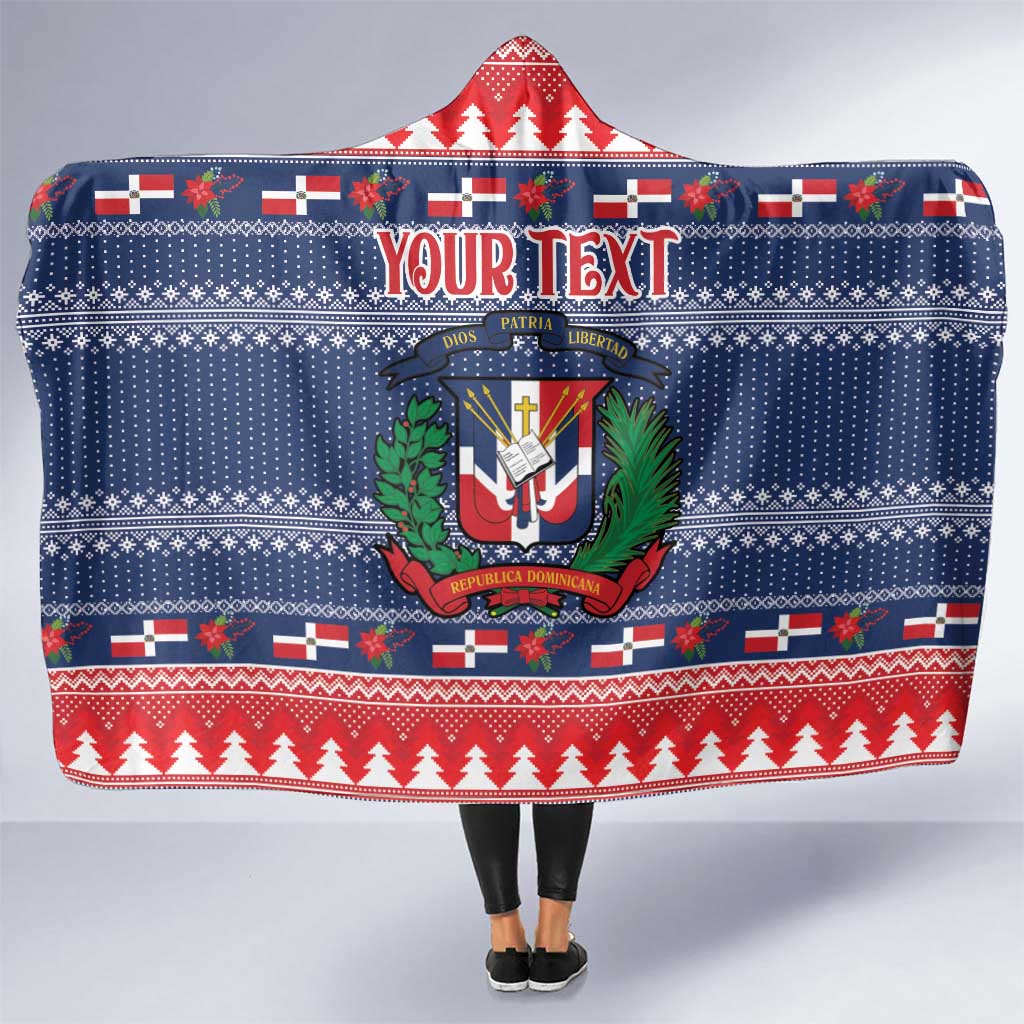 Blue hooded blanket with red and white Christmas pattern and Dominican crest
