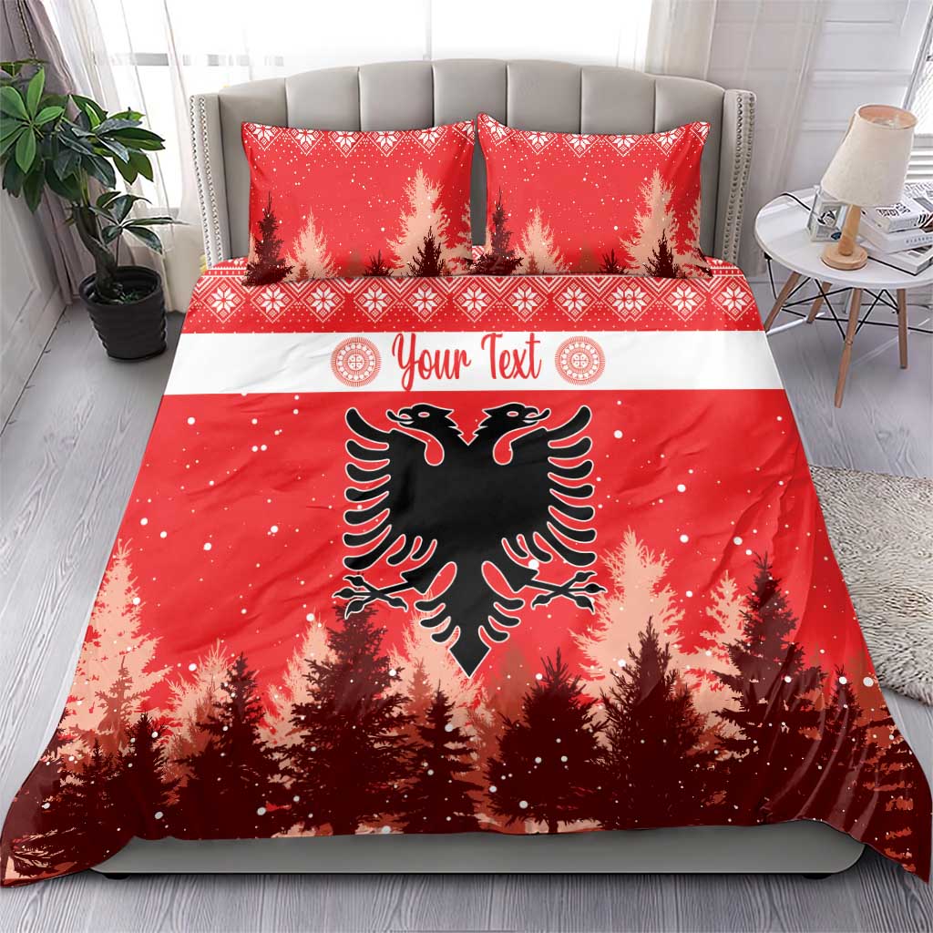 Red Christmas bedding set on bed with two matching pillows; eagle emblem and pine trees.