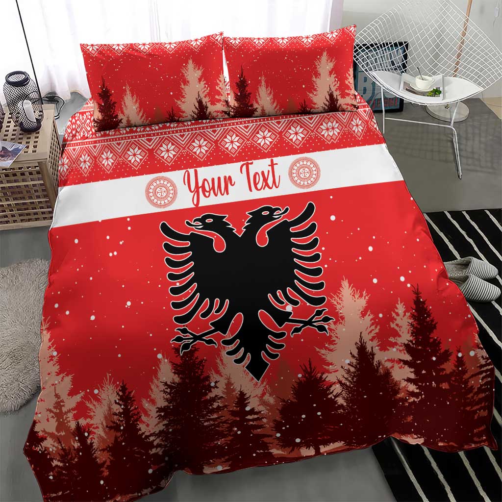Red Christmas bedding set with two pillows; eagle emblem centered on pine tree background.