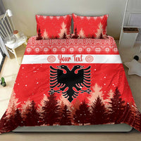 Red Christmas bedding set with two pillows; double-headed eagle emblem with snowy pine trees.