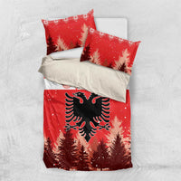 Red Christmas bedding set with pillow pair; eagle emblem on pine forest and snowy speckles.