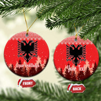 Red ceramic round ornament with double-headed eagle and personalized holiday lettering, hanging loop.