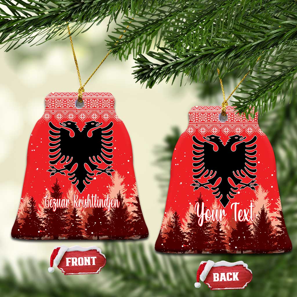 Red ceramic bell-shaped ornament with double-headed eagle and personalized holiday lettering, hanging loop.