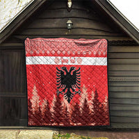 Red quilt with white stripe and personalized text, featuring Albanian double-headed eagle