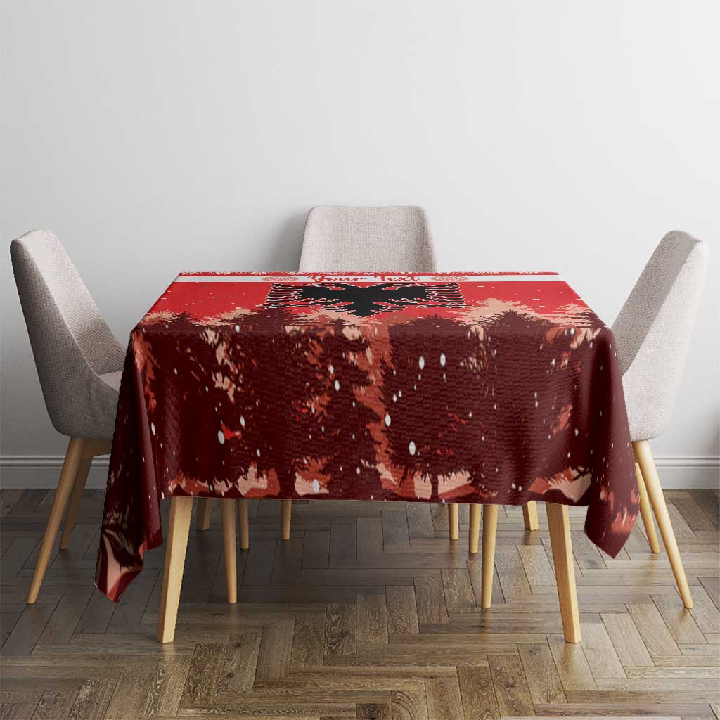 Red Christmas tablecloth covering dining table with speckled pine and eagle pattern