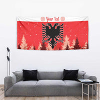 Red holiday tapestry showing double-headed eagle over pine trees with striped decorative header.