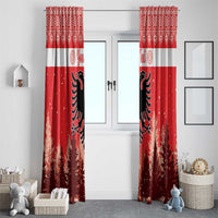 Red Christmas window curtain pair with white band, black eagle, and snowy forest tree print