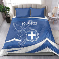 Blue duvet and pillowcases with Greek flag day angel-and-cross emblem and striped banner