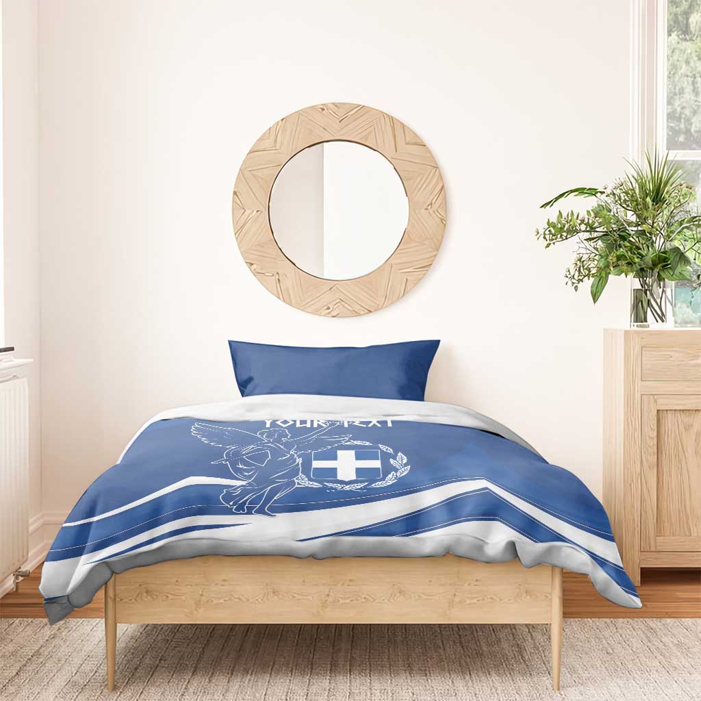 Blue and white duvet and pillows with Greek flag day emblem print on bed