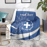 Personalized Greek flag day blanket on gray chair, blue-and-white angel and shield design
