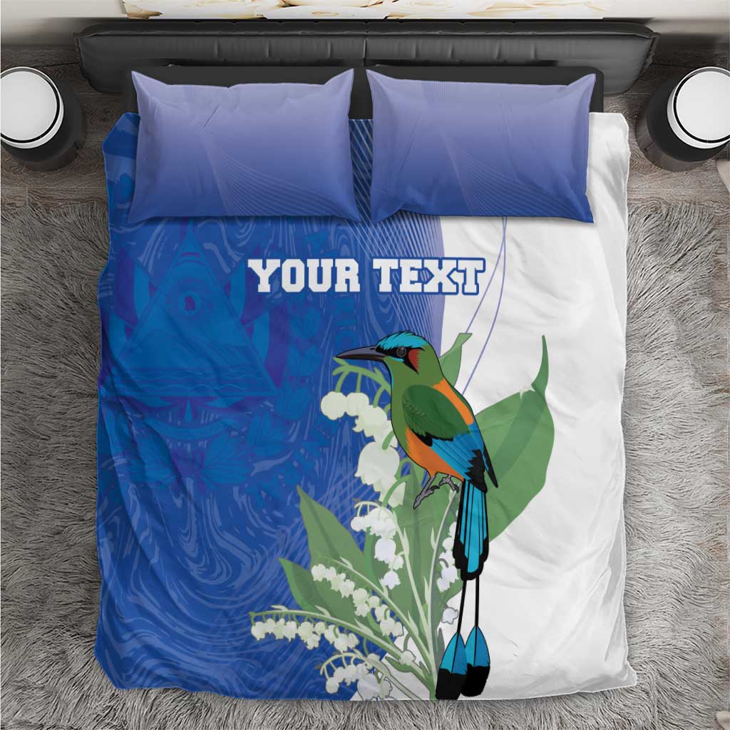 Personalized bedding set close-up: blue duvet panel with green bird, yucca flowers, 2 blue pillows