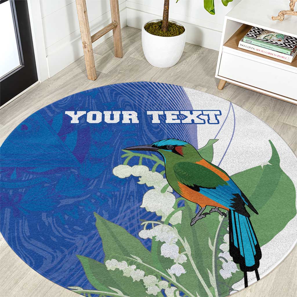 Round blue area rug with turquoise bird, white blossoms, and personalized text
