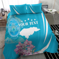 Turquoise duvet and pillow shams with white wave stripes, map graphic, orchids, “Your Text”