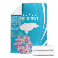 Personalized blue and white blanket with 'YOUR TEXT', stars and floral bouquet