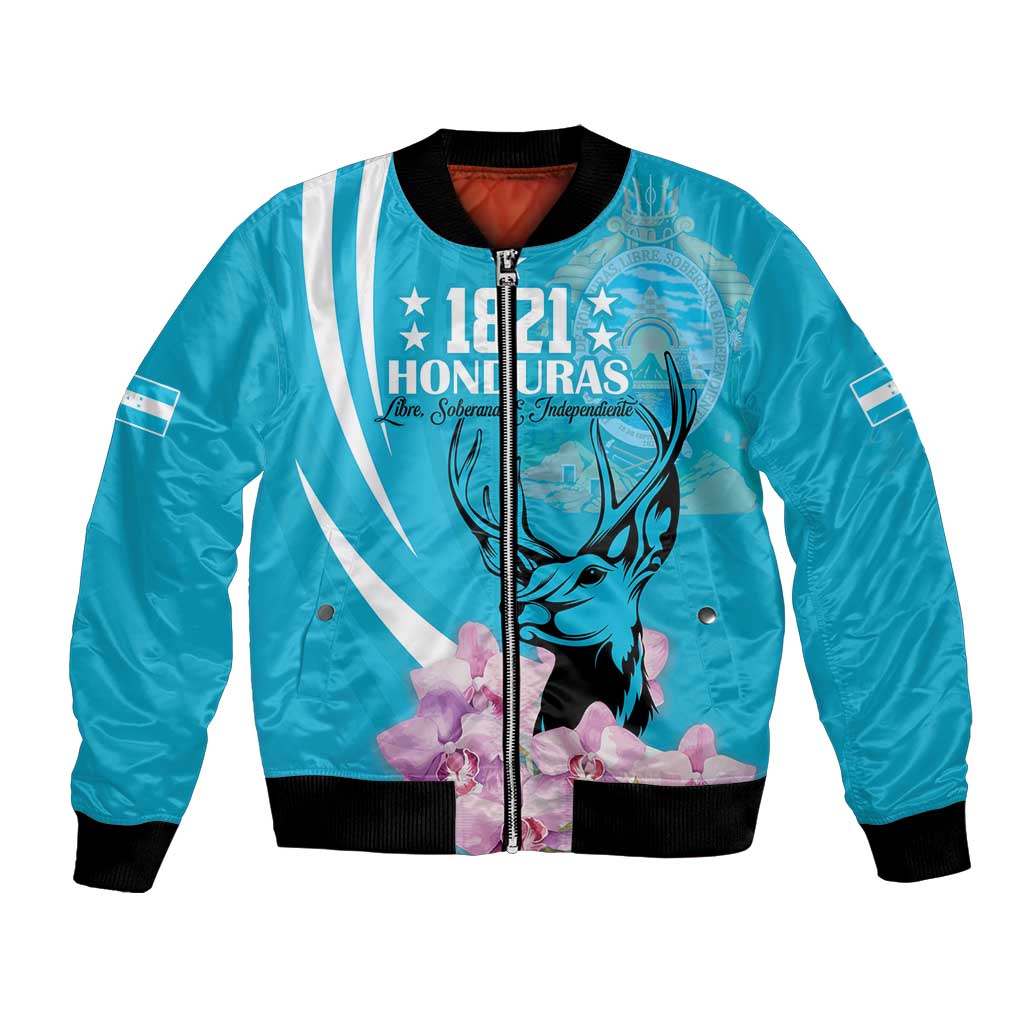 Blue bomber jacket with front graphic of deer, flowers, and striped details; ribbed cuffs