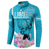 Blue button sweatshirt with 1821 Honduras text, deer face and pink orchids