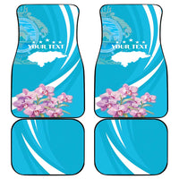 Set of four blue car mats with white curved stripes and pink floral design