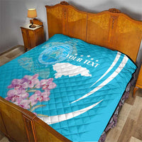 Personalized blue quilt with deer outline, Honduras flag map, and white text on bed