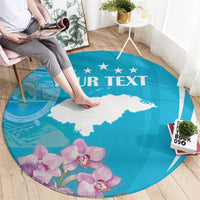 Blue round area rug with white deer silhouette and purple orchids, 'YOUR TEXT' centered.