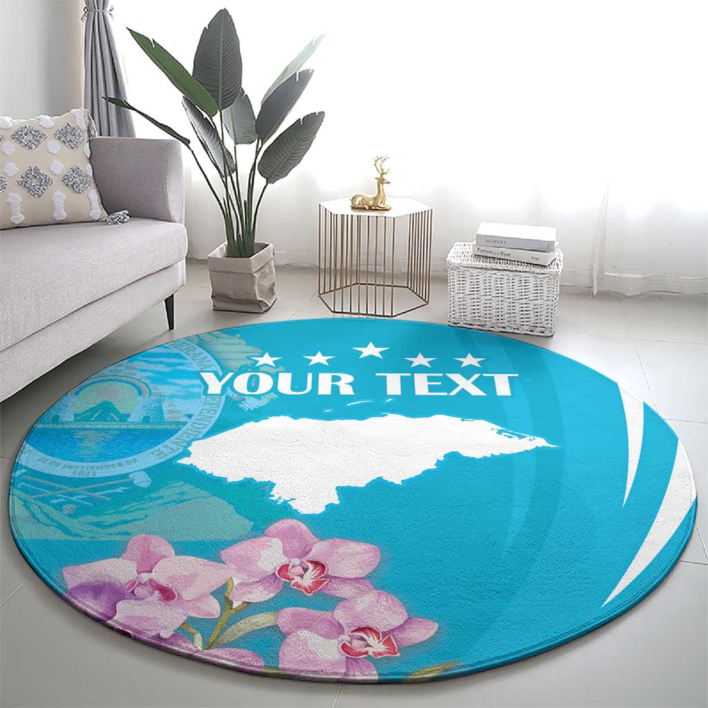 Blue round area rug featuring white deer silhouette, 'YOUR TEXT' banner, purple orchids.