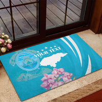 Blue rubber doormat on entry step, with white map, orchids, and custom text.