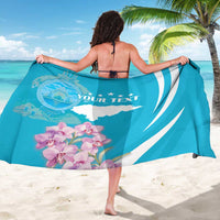 Personalized blue sarong with white wave stripes, orchids, map shape, and "YOUR TEXT"