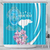 Blue shower curtain with Honduras crest, custom text, white stripes, and pink orchid bouquet