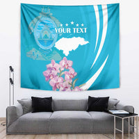 Blue tapestry wall hanging with crest, stars, orchids, and white 'YOUR TEXT' design.