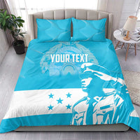 Blue and white bedding set with "YOUR TEXT" graphic on comforter and matching pillowcases