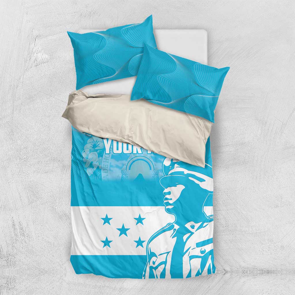 Blue and white personalized bedding set with "YOUR TEXT" print and two matching pillows