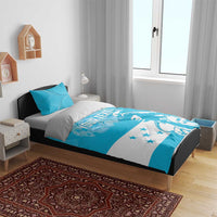 Blue and white bedding set with "YOUR TEXT" graphic across comforter and pillow set