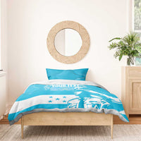 Blue and white personalized bedding set with "YOUR TEXT" graphic on comforter and pillows