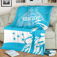 Blue and white blanket with “YOUR TEXT,” star details, and a large figure silhouette