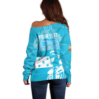 Blue off-shoulder sweater with back graphic, stars, and bird illustration