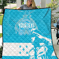 Personalized blue quilt with Honduras bird graphic and star accents, quilted texture