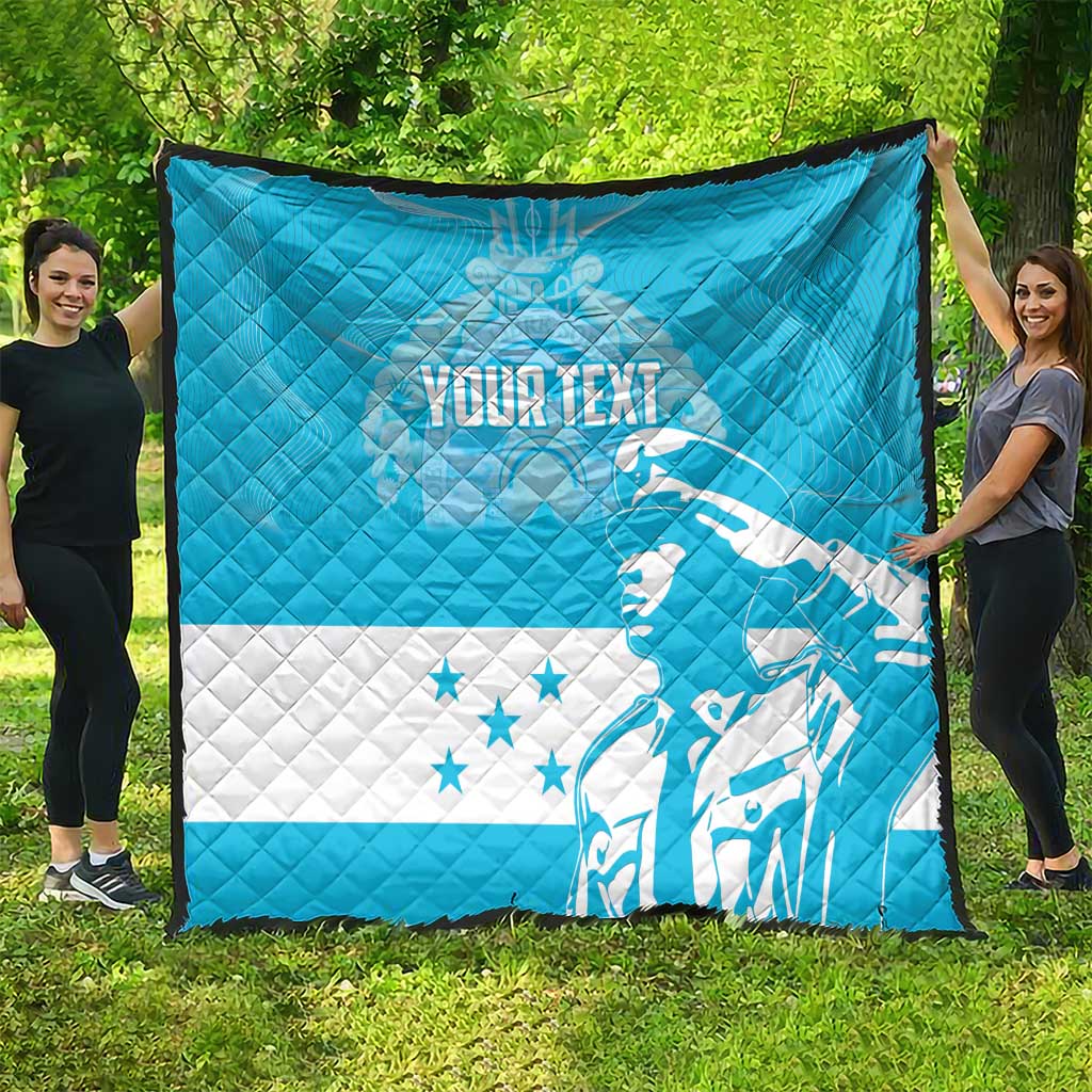Personalized blue quilt with white Honduras bird graphic and star accents, quilted pattern