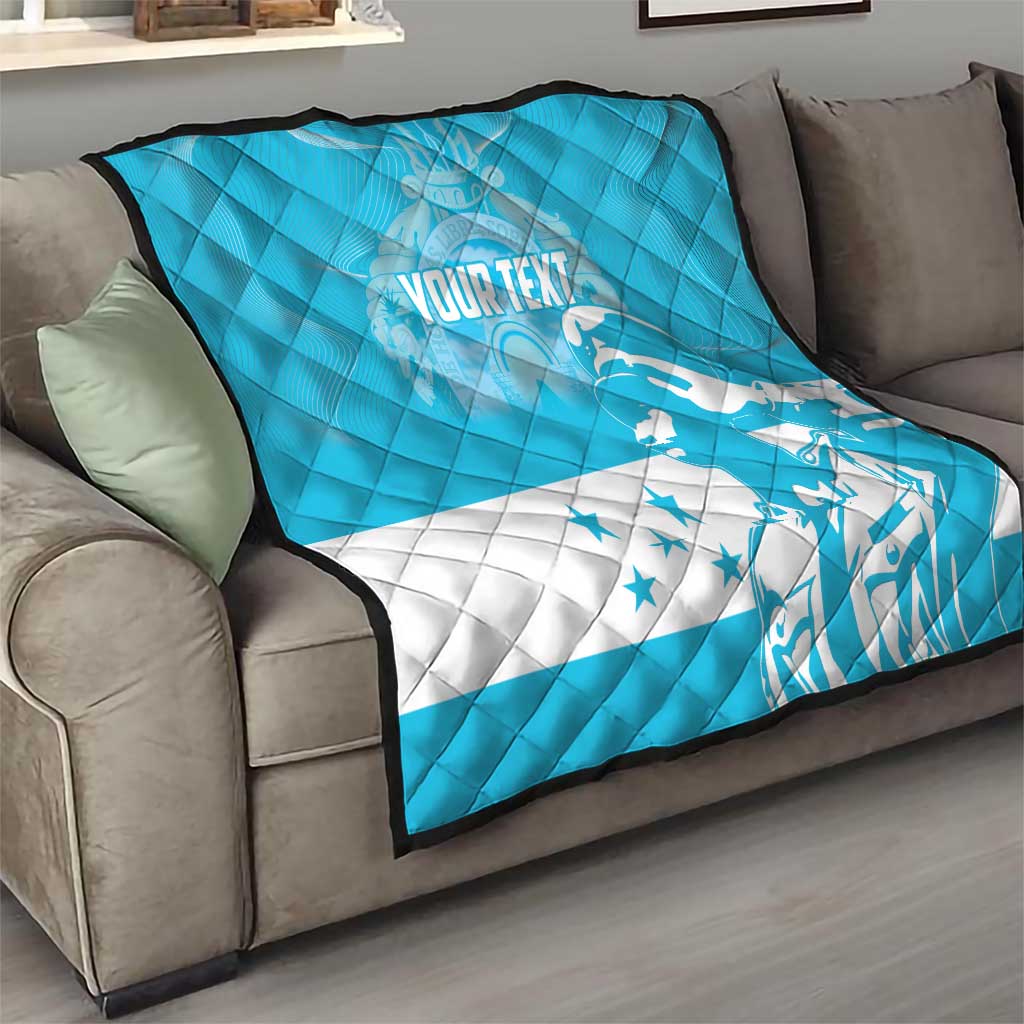 Personalized blue quilt with Honduras bird and stars, draped on sofa
