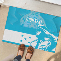 Blue rubber doormat with bird illustration, 'YOUR TEXT' banner, and white star panel