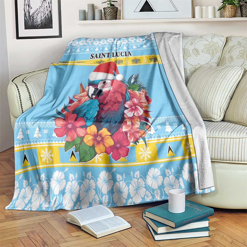 Blue Christmas blanket with Saint Lucia text, red-and-blue parrot, hibiscus flower print